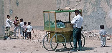 A travelling salesman negotiating his wares, 1972