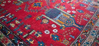 Detail of a colourful inexpensive tufted carpet