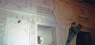 A decorated wall in an inhabited room in Wakra, 1972