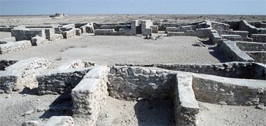 Some of the ruins of al-Zubara with the remains of a circular tower top left